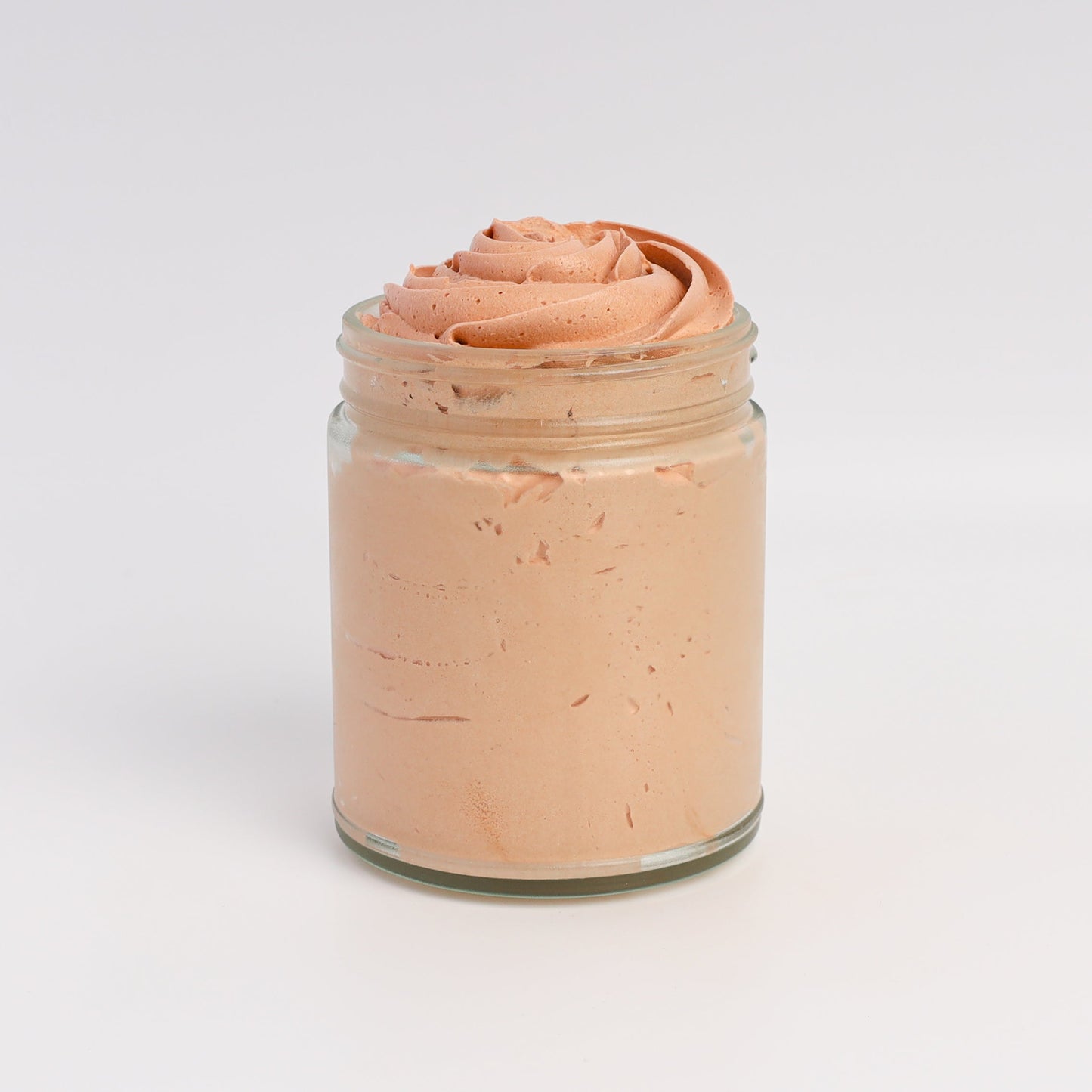 Applying bronze whipped tallow to skin for a natural sunlit glow
