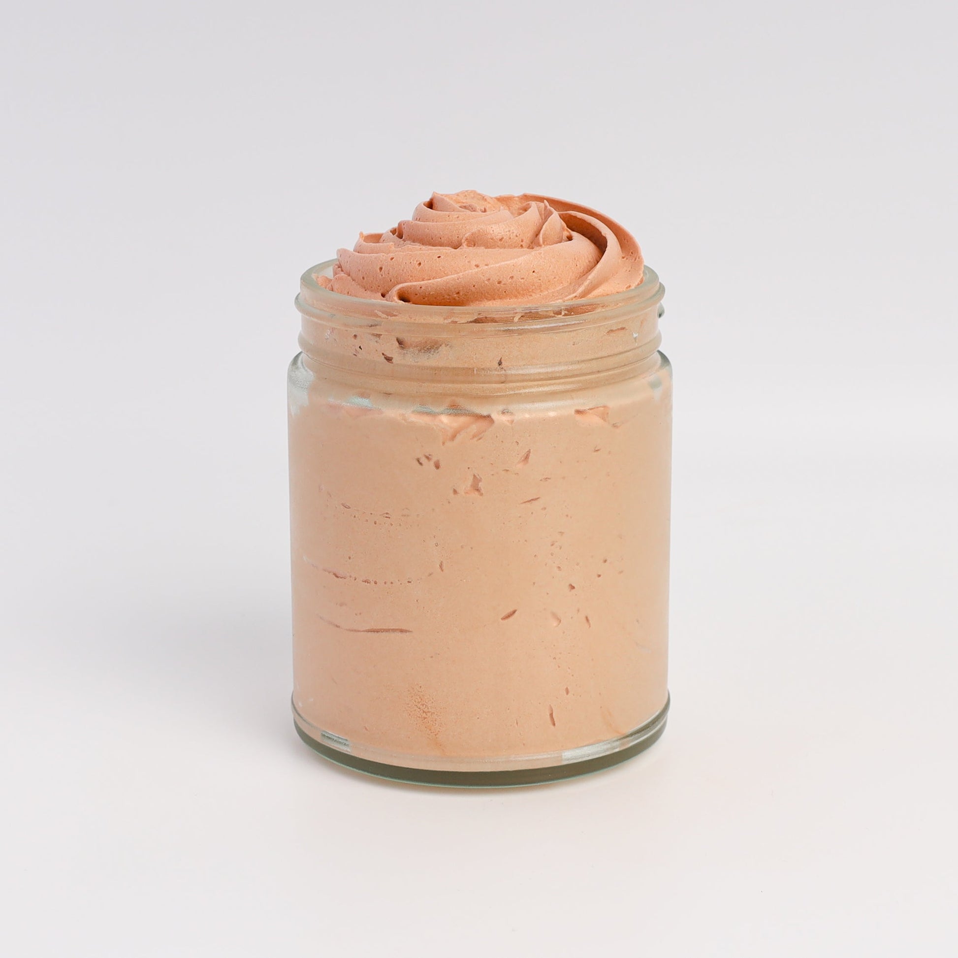 Applying bronze whipped tallow to skin for a natural sunlit glow
